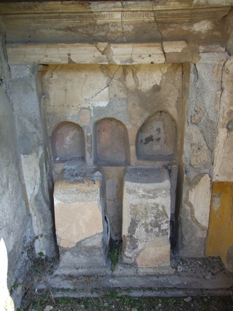 VI.15.5 Pompeii. March 2009. Room 1 with 3 niches and 2 altars in rectangular niche in atrium.