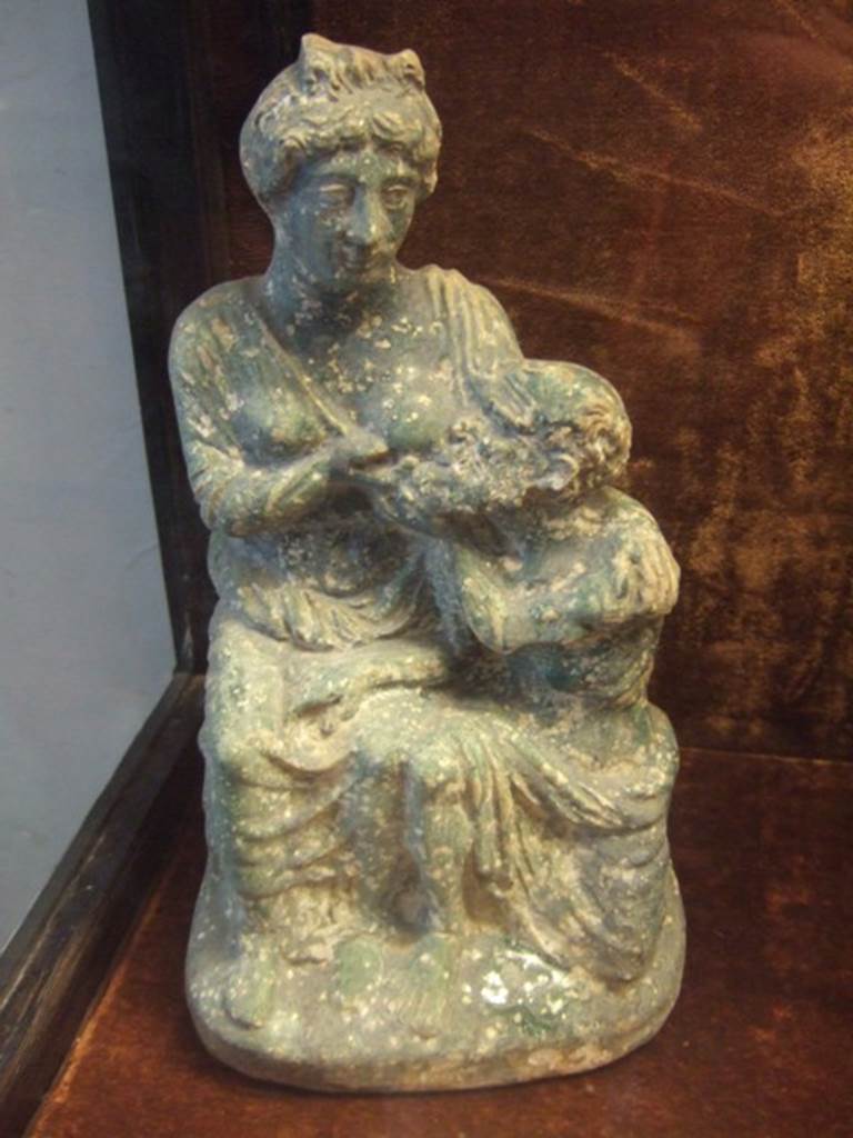 VI.15.5 Pompeii.  Statuette of Perona and Micone.   Now in Naples Archaeological Museum.  MANN inventory number 124846.  See 3 Oct 1895 NSA 1895, page 438 VI, xv, 5, Garden, West side,  Our thanks to Raffaele Prisciandaro for his help in identifying this object.
