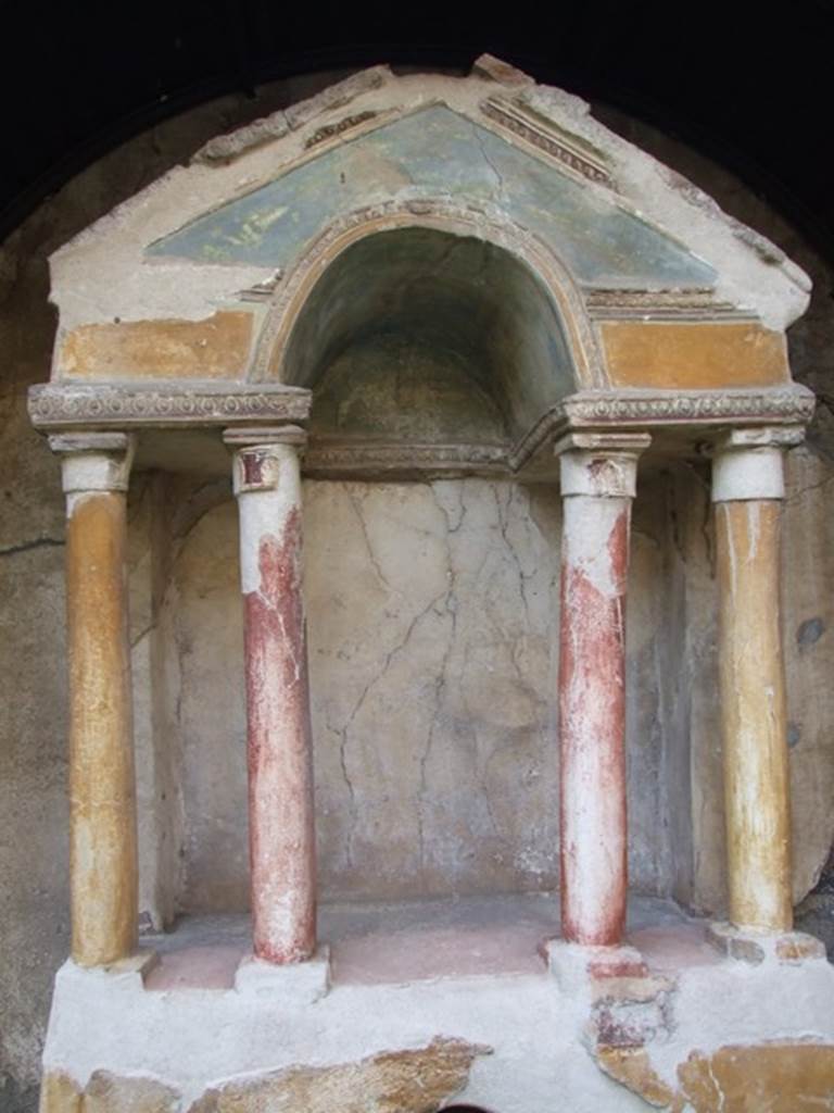 VI.15.8 Pompeii. Painted columns and pediment on household shrine in the garden.