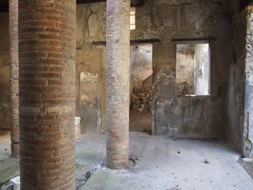 VI.15.9 Pompeii. March 2009. Looking west along north side of atrium towards triclinium with window.