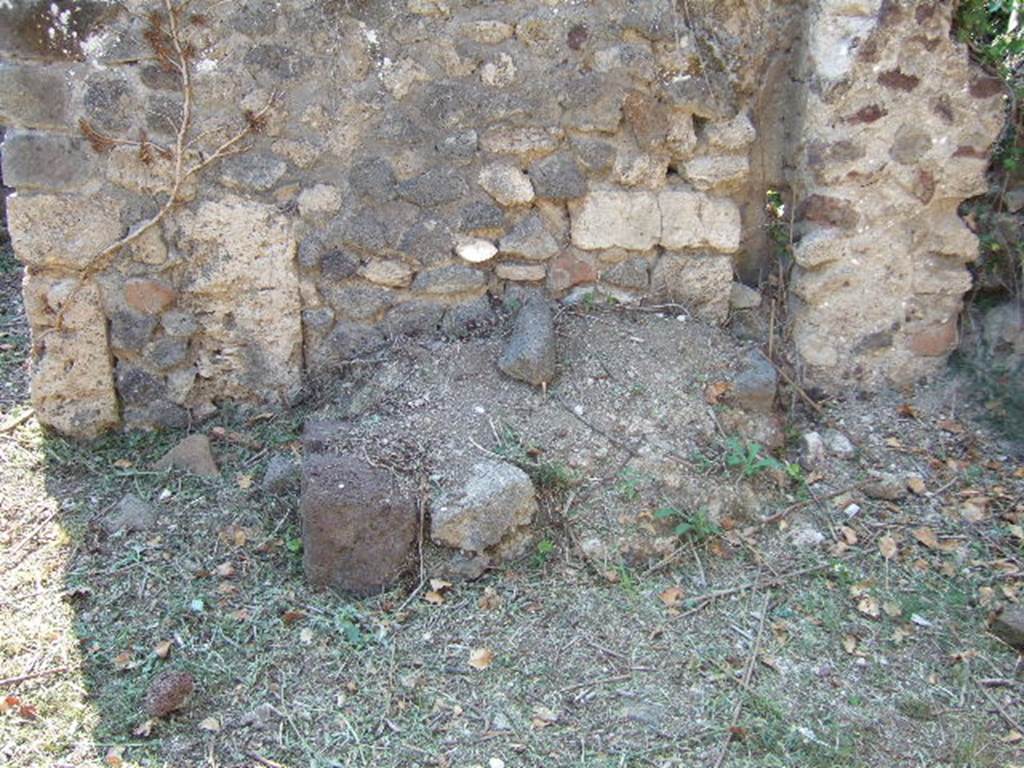 VI.15.20 Pompeii. September 2005. Looking west at remains of structure against west wall of atrium.