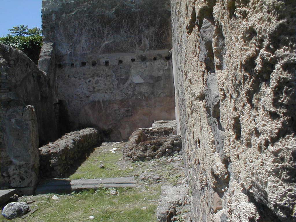 VI.16.3 Pompeii. May 2005. Looking west along north wall, towards rear room in VI.16.3.  