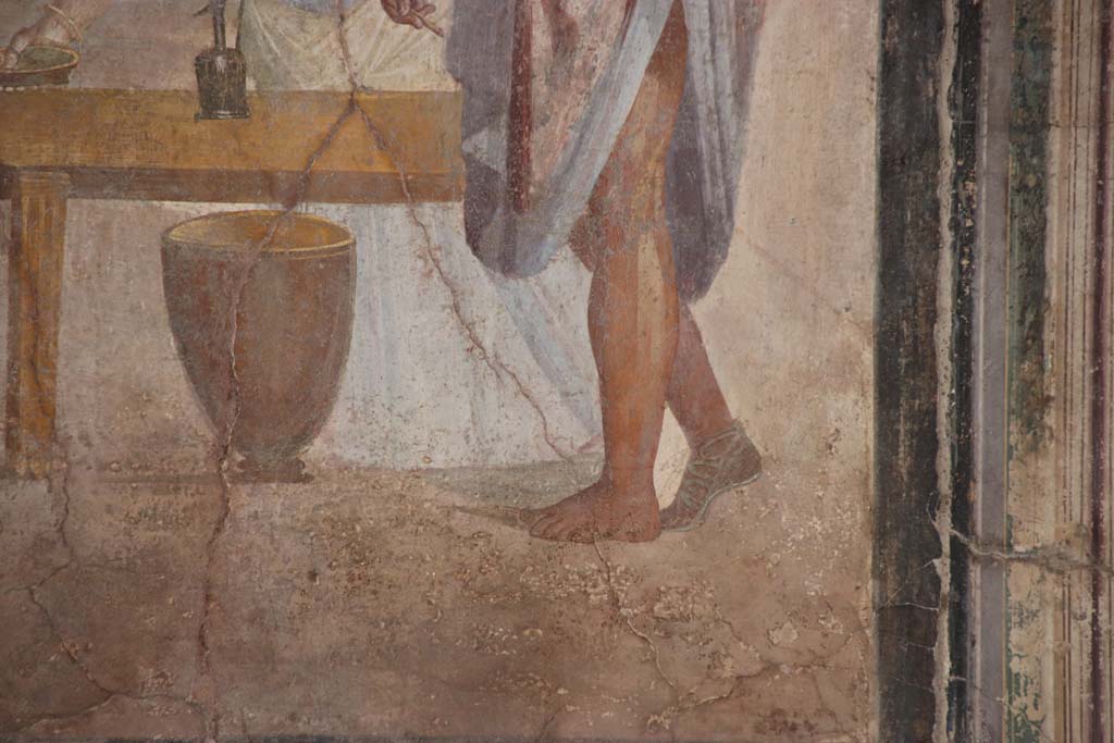 VI.16.7 Pompeii. September 2021. 
Room G, east wall of oecus, detail from painting showing legs and feet, with one sandal. Photo courtesy of Klaus Heese.
