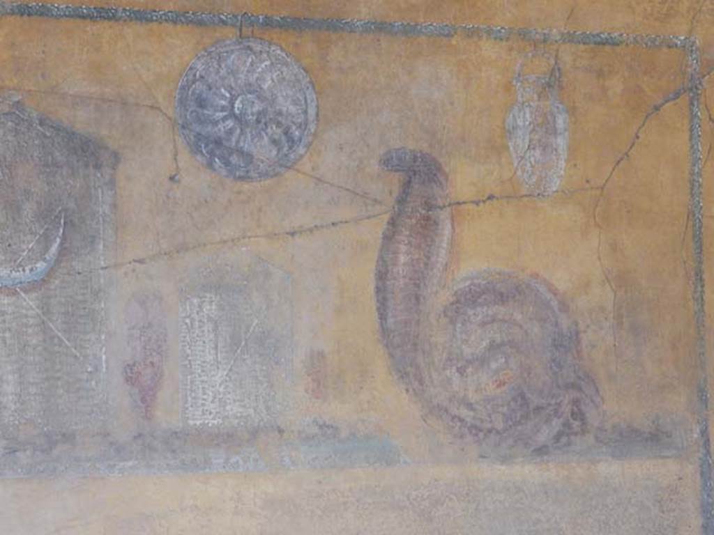 VI.16.7 Pompeii. May 2016. Room F, detail from east wall of lararium.
Photo courtesy of Buzz Ferebee.
