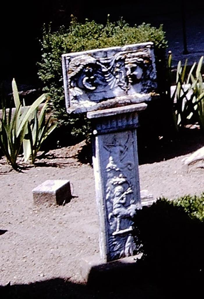 VI.16.7 Pompeii. 1964. Marble relief with masks on a pilaster in peristyle garden room F.
SAP inventory number 20461. Detail from photo by Stanley A. Jashemski.
Source: The Wilhelmina and Stanley A. Jashemski archive in the University of Maryland Library, Special Collections (See collection page) and made available under the Creative Commons Attribution-Non-Commercial License v.4. See Licence and use details.
J64f1871

