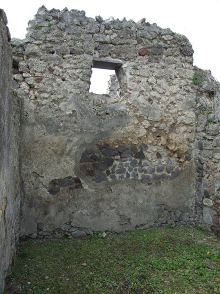 VI.16.32 Pompeii. March 2009. Room D, west wall with window. According to NdS, the walls of this room were rustic and in the west wall was a window. In June 1904, many items of bronze, gold, silver, glass, crystal, lead, iron and marble, were discovered in this room on the floor along the south and west walls. Among them were two bronze seals. On one was written in beautiful prominent letters -
