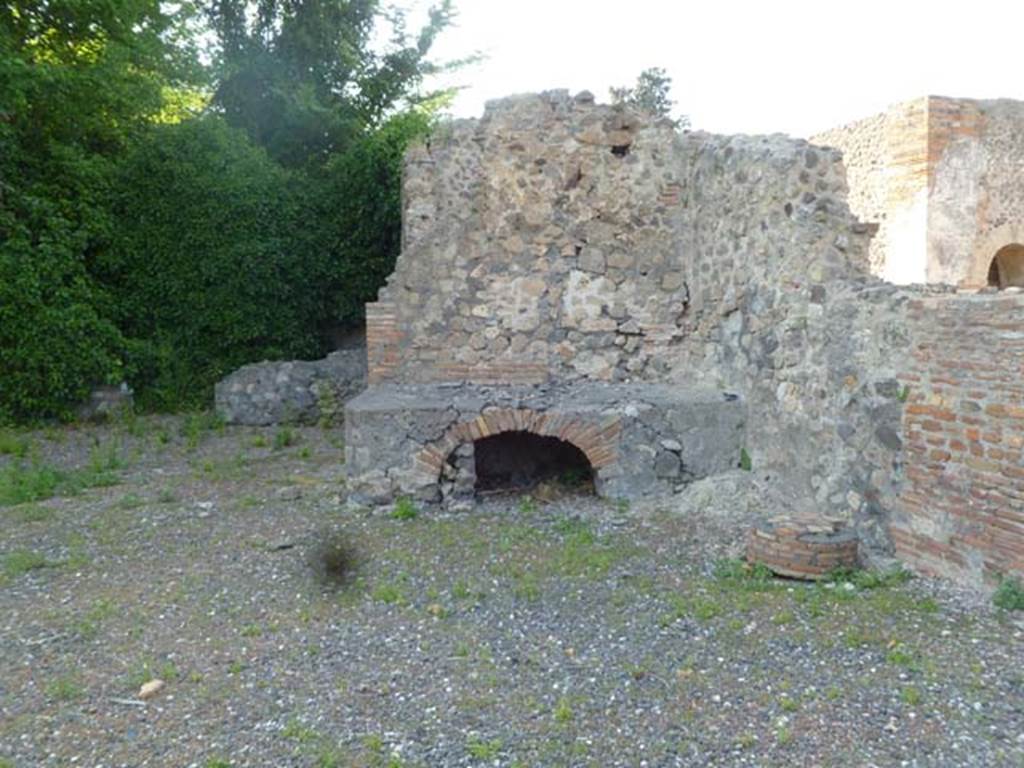 VI.17.1 Pompeii. May 2011. Looking north towards hearth on north side of entrance doorway.