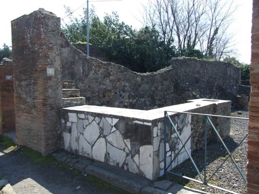 VI.17.4 Pompeii. March 2009. Entrance doorway and marble counter.