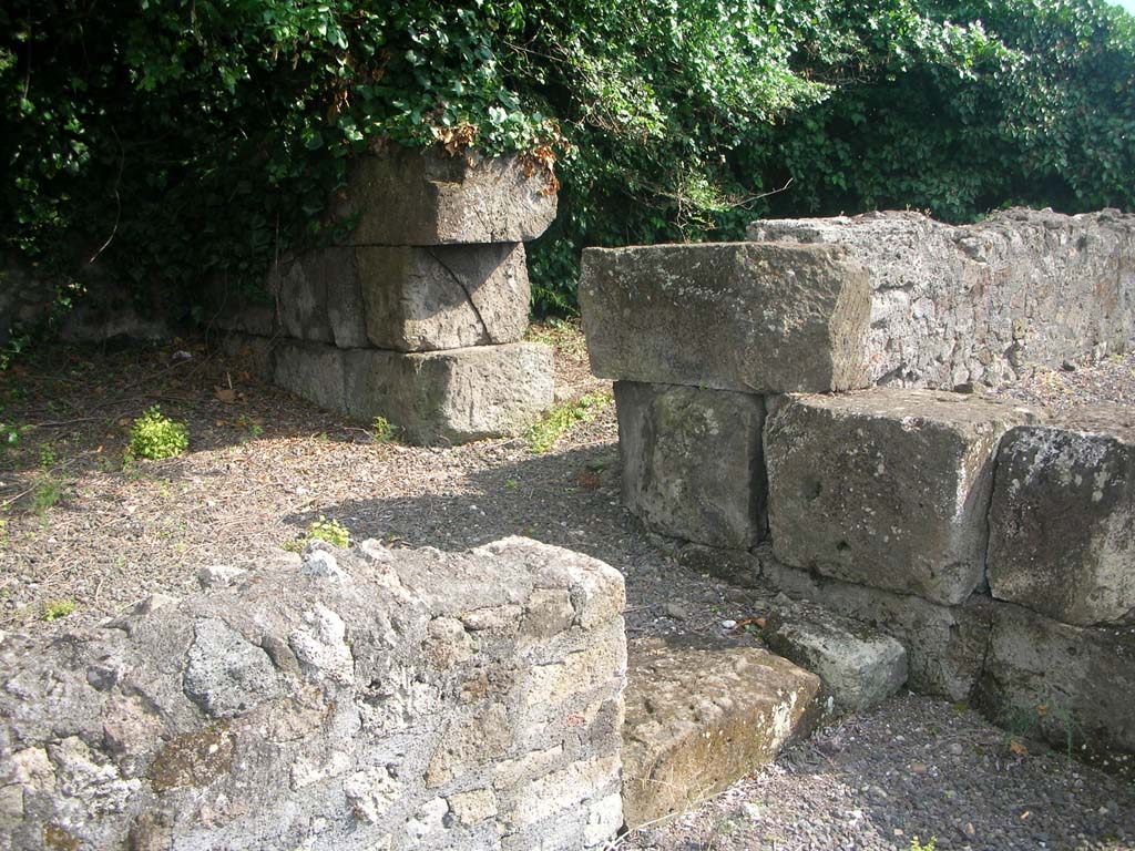 VI.17.4 Pompeii. May 2010. 
Looking south-west towards doorway to second room in south-west corner at rear of bar, with detail of walling. Photo courtesy of Ivo van der Graaff.
