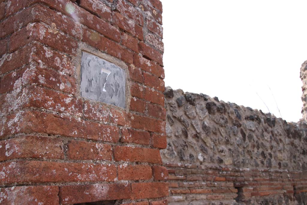 VI.17.7 Pompeii. September 2021. Pilaster on south side of doorway. Photo courtesy of Klaus Heese.