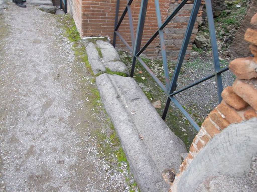 VI.17.34 Pompeii. December 2007. Threshold or sill on south side of doorway, with remains of three steps.