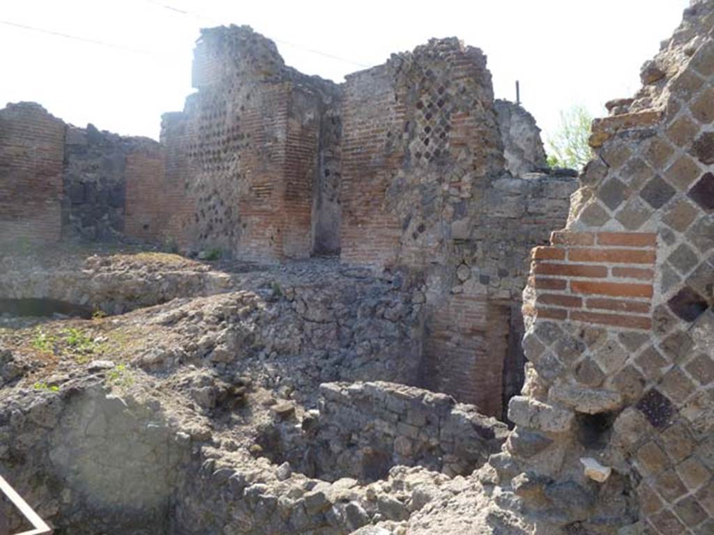VI.17.36 Pompeii. May 2011. North side, with both upper and lower levels. Photo courtesy of Michael Binns. Possibly the upper level on the right of this photo may have been the area as described in PAH, 1, 3, (p.4)  “1-18th Maggio 1808 – Il giorno 15 del corrente venne il Re a Pompei, ed in sua presenza si scavarono due stanze e due botteghe appartenenti alla casa di Polibio. In una di queste stanze la fabbrica era alquanto diroccata, ed il pavimento in musaico bianco e nero, con un quadro nel mezzo di musaico colorito rappresentante la figura di Atteone; detto quadro era di circa palmi due in quadro. Nell’altre stanze le pareti sono tutte dipinte con varii arabeschi, e vi sono due quadri, uno con figura di uomo sedente con puttino, l’altro con due figure sedenti una di uomo a l’altra di donna con puttino.  Detti quadri sono di palmi 1 and three-quarters in quadro. In questa stanza e nelle due botteghe si era trovato quanto segue –”
(translation – "1-18th May 1808 –  On the 15th day of the current month the King came to Pompeii, and in his presence they dug two rooms and two shops belonging to the House of Polybius. In one of these rooms the structure was somewhat dilapidated, and the floor in black and white mosaic, with a picture in the middle of colorful mosaic representing the figure of Actaeon; this picture was approximately 0.53m square).  In the other rooms the walls were all painted with various arabesques, and there were two paintings, one with a figure of a sitting man with a small cherub, (NAP inv. no: 9382, Helbig 1357), the other with two sitting figures, a man and a woman, with a small cherub.  These paintings are approximately 0.46m square. In this room and in the two shops, the following were found, (see list p.4-6) –”

“28 Maggio 1808 – Nella casa detta di Polibio a Pompei si sono terminate di ricercare, la stanza che resta alla destra dell’ingresso, e le due botteghe della stessa abitazions, che s’incominciarono a frugare il di 15 di questo mese………………...  Quello che si trovo……..., e quell’altro poco che in seguito si era rinvenuto, era il seguente – Argento……(p4-6 elenco). (translation: “28th May 1808 –  In the house called of Polybius in Pompeii, they had finished searching, the room that is to the right of the entrance, and the two shops in the same dwelling, which they had begun to search on the 15th of this month……………….  The items found, ………… and those others found later, were as follows – Silver............ (p4-6 list)”

