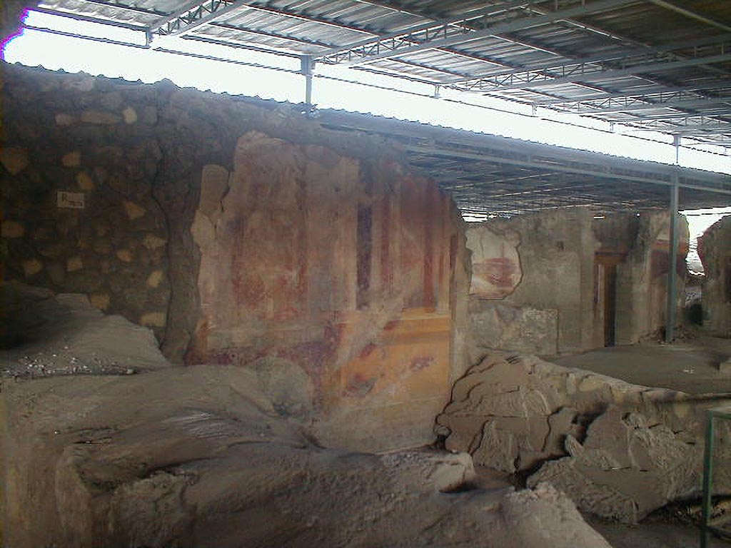 VI.17.41 Pompeii. September 2004. 
Looking north-west towards west wall of triclinium with painted decoration, on south side of atrium.
