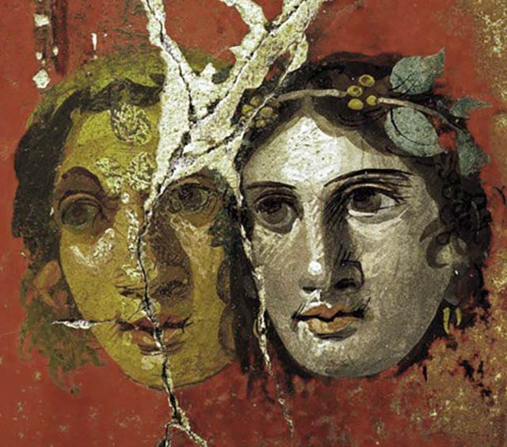 VI.17.42 Pompeii. Oecus 32. Detail of two faces from upper part of west wall.
Inventory number 40693.
