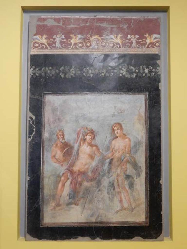 VI.17.42, Pompeii, May 2018.
Triclinium 20, north wall of triclinium depicting the abandonment of Ariadne on Naxos and the arrival of Dionysus bewitched by the young lady.
Parco Archeologico di Pompei, inventory number 41658. Photo courtesy of Buzz Ferebee.