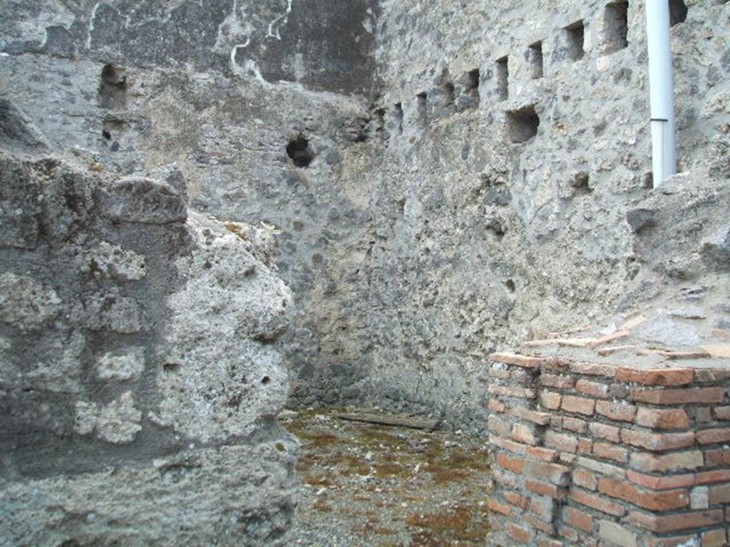 VII.1.16 Pompeii. May 2005. Looking into room on south of workshop, on left from entrance.