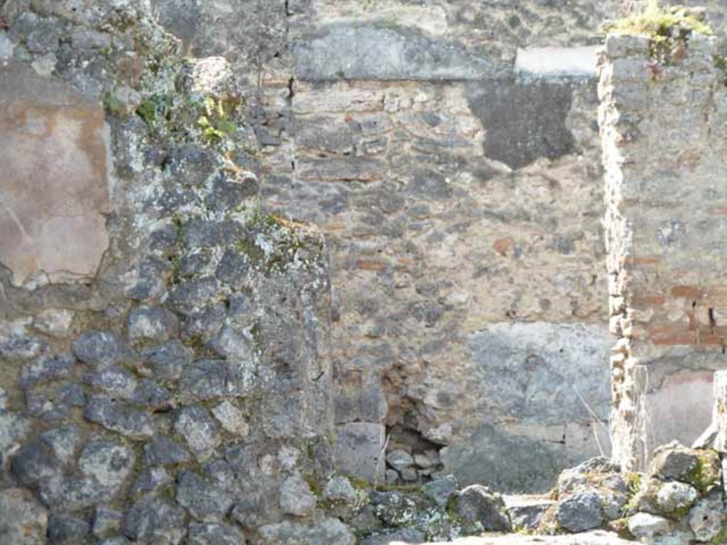 VII.1.27 Pompeii. May 2010. Looking west over the wall of the rear room towards the small garden. See Jashemski, W. F., 1993. The Gardens of Pompeii, Volume II: Appendices. New York: Caratzas. (p. 169) According to Fiorelli, it was possible that the names of VIBIA and AMEIA found painted on one of the walls of the garden were the names of two women who worked here. [CIL IV 2345] See Pappalardo, U., 2001. La Descrizione di Pompei per Giuseppe Fiorelli (1875). Napoli: Massa Editore. (p.76)

