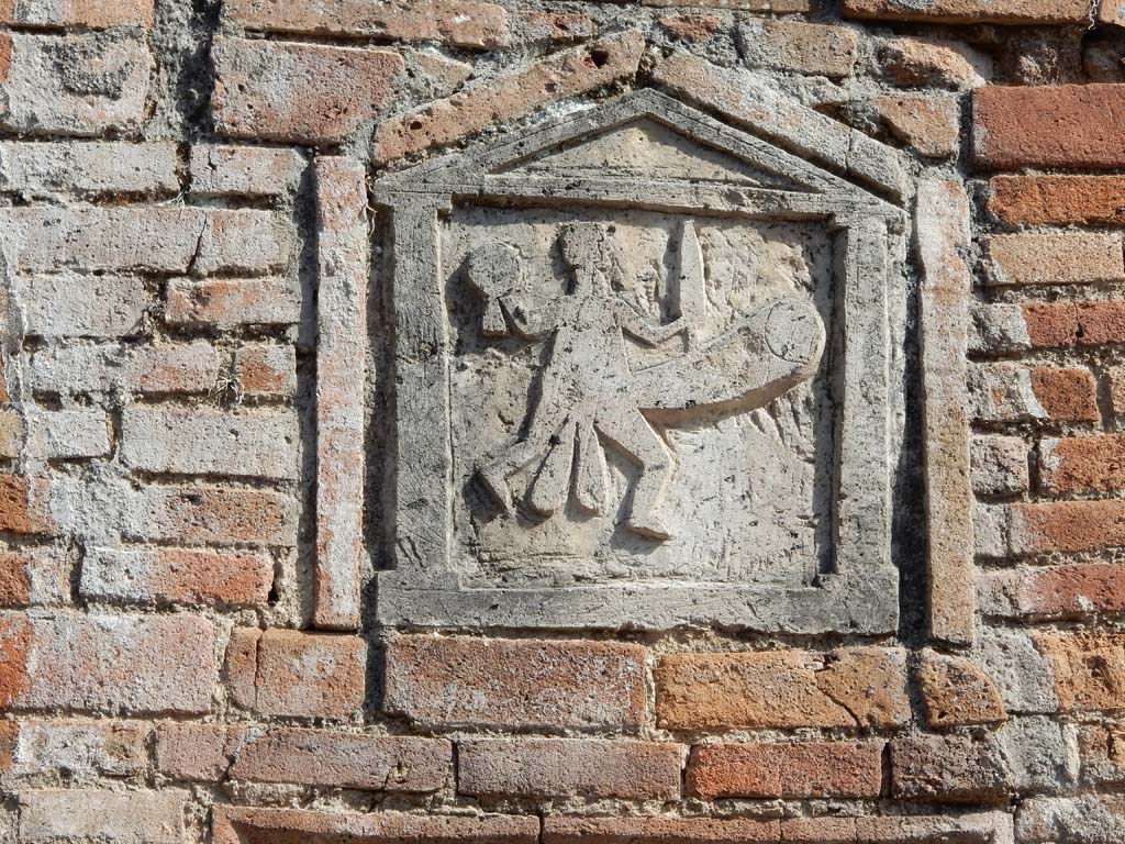 VII.1.36 Pompeii. June 2019. Detail of ithyphallic plaque. Photo courtesy of Buzz Ferebee.