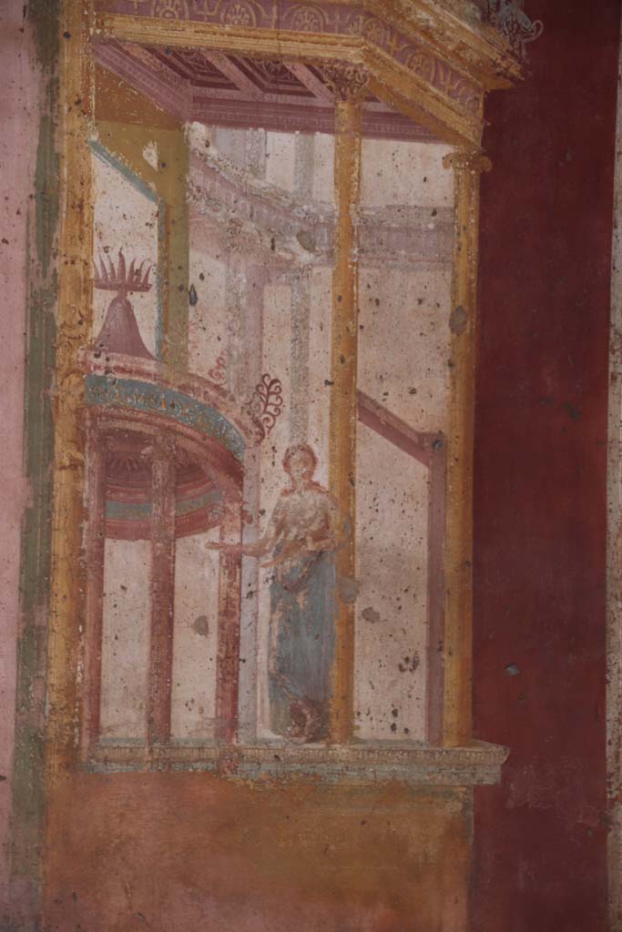 VII.1.47 Pompeii. September 2017.  
Exedra 10, detail of muse (Clio or Calliope?) in painted architectural decoration on east side of central painting on north wall.
Photo courtesy of Klaus Heese.    
