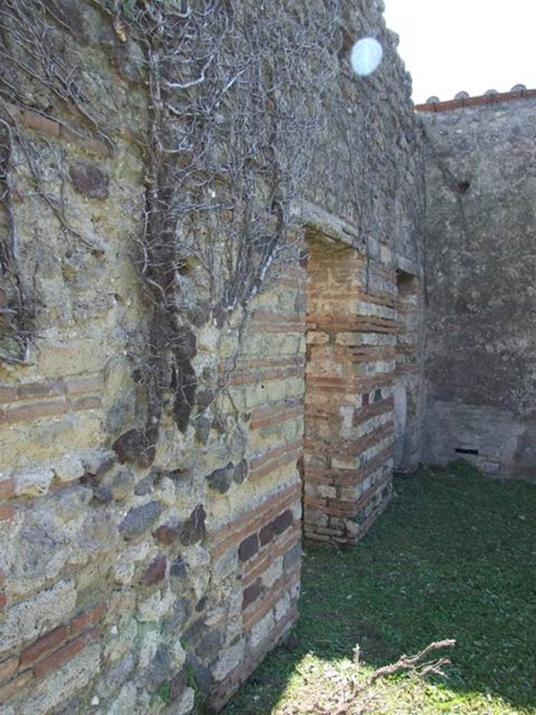 VII.2.18 Pompeii. March 2009. Doorways to room 14 and 15, cupboards.