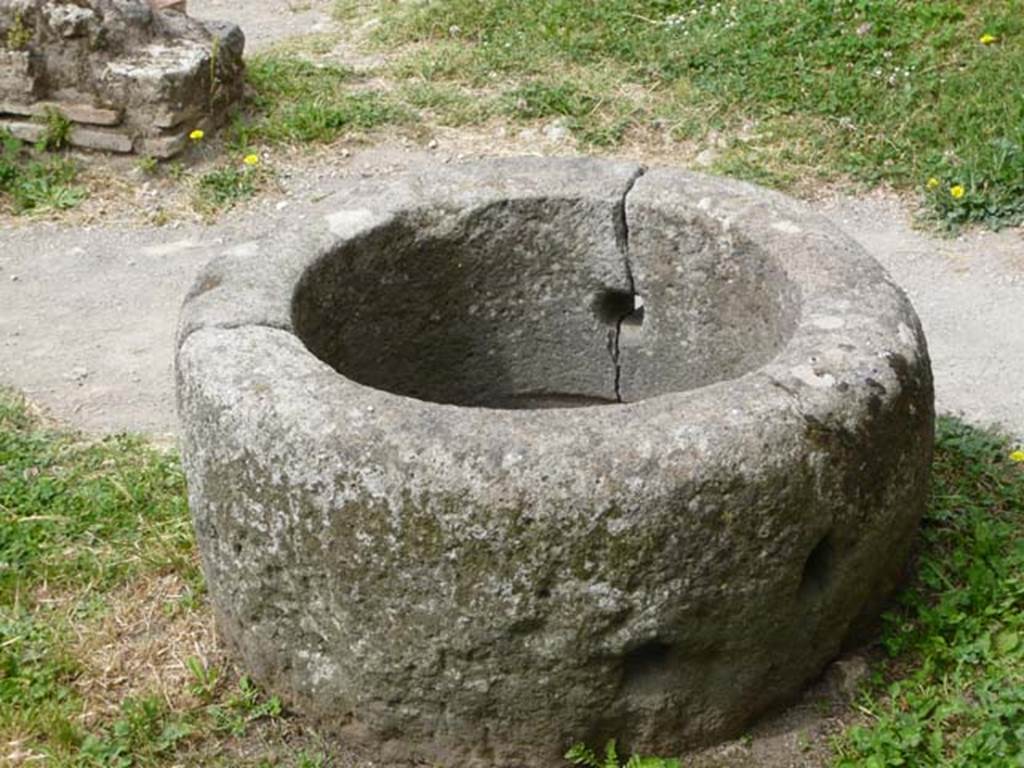VII.2.22 Pompeii. May 2012. Circular stone with holes. Photo courtesy of Buzz Ferebee.
