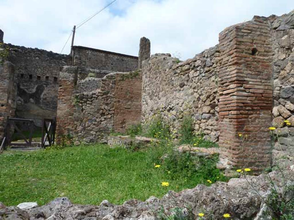 VII.2.27 Pompeii. May 2010. Looking north-west from VII.2.35 towards podium.