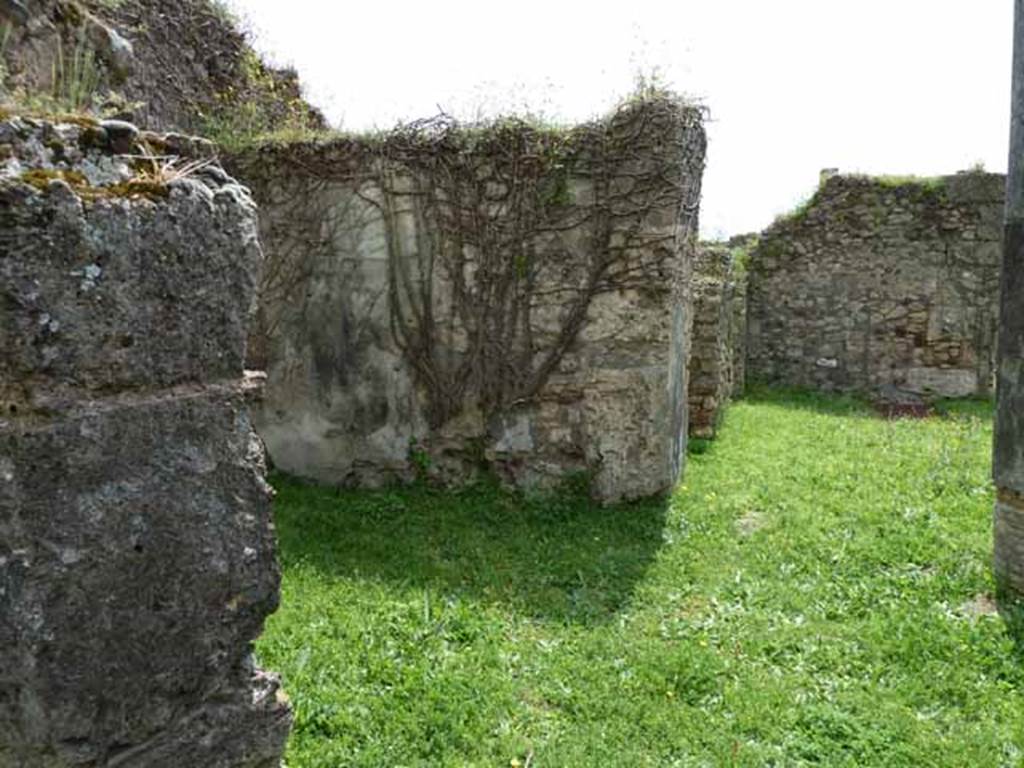 VII.2.35 Pompeii. May 2010. East side of atrium, looking south past doorways to ala, cubiculum and kitchen.