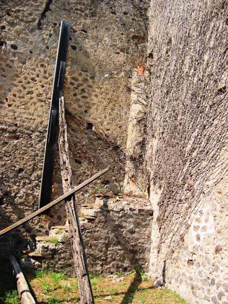 VII.2.42 Pompeii. July 2008. Steps in north-east corner of shop. Photo courtesy of Barry Hobson.