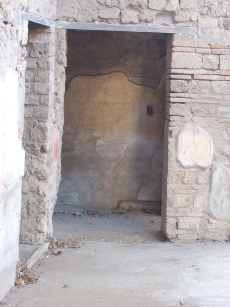 VII.2.45 Pompeii. September 2005. Ahead is the doorway to room on north side of atrium.
To the left is the doorway to the room with the stairs on the west side of the atrium.