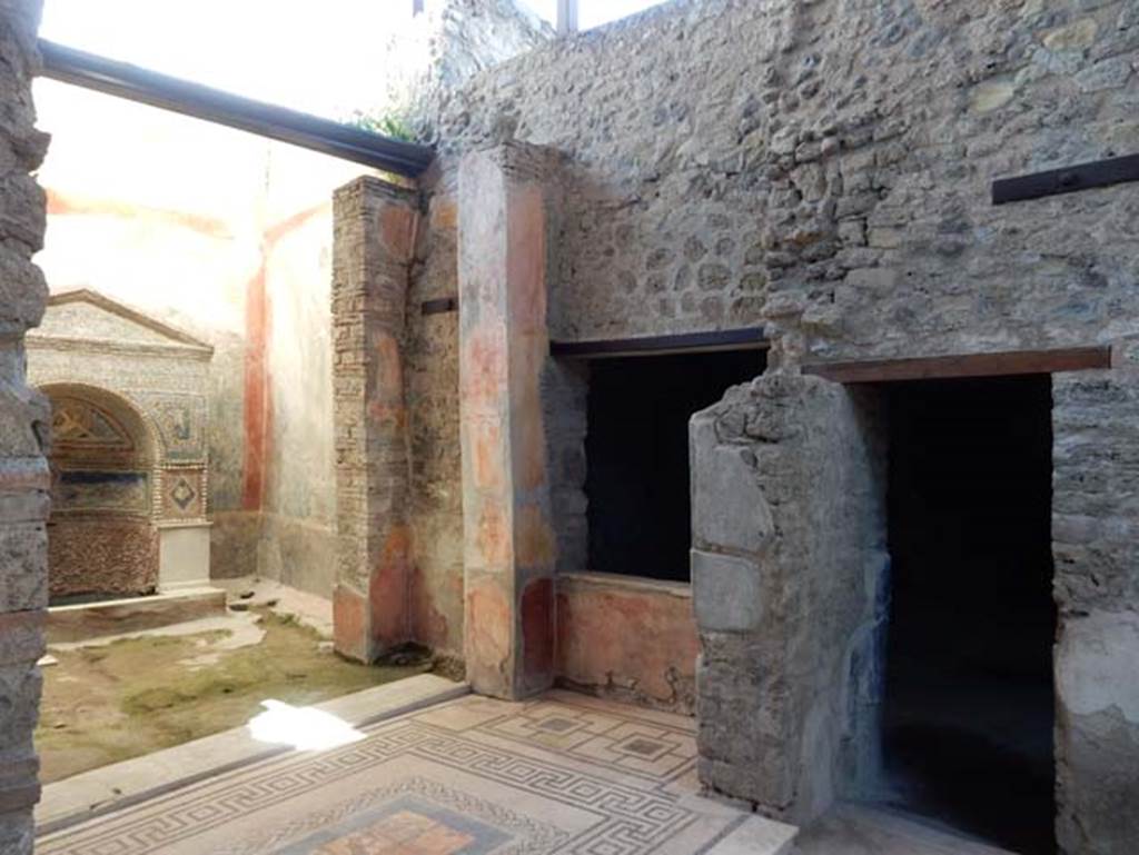 VII.2.45 Pompeii, May 2018. Looking north-east across tablinum towards window in east wall into triclinium.
The doorway to the triclinium is on the right. Photo courtesy of Buzz Ferebee.