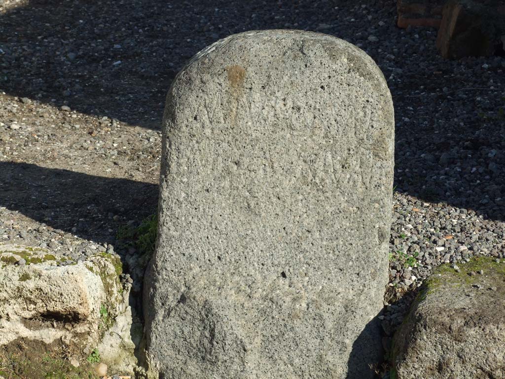 VII.4.2 Pompeii. December 2007. 
Boundary marker made of volcanic tufa between Temple of Fortuna Augusta and the Area Privata of M. Tullius, discovered 26th October 1823.
The inscription read:
M(arci)  Tulli  M(arci)  f(ilii)
area privata     [CIL X 821]
This translates as - “Private land of Marcus Tullius, son of Marcus”. 
