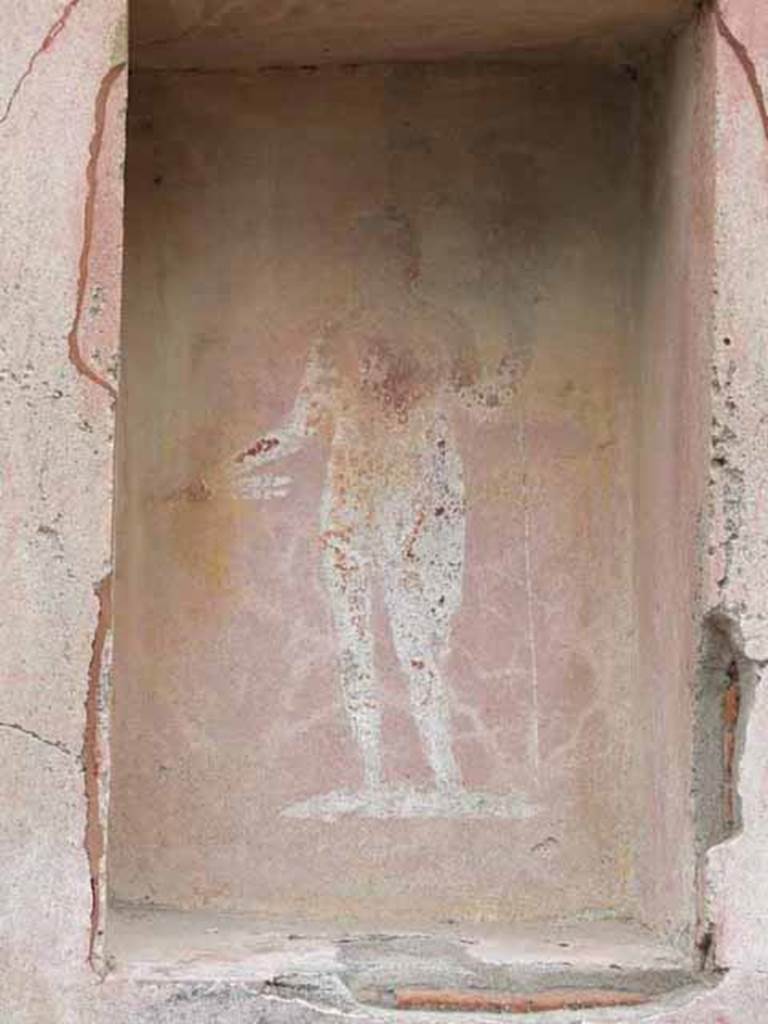 VII.4.17 Pompeii.  May 2010. Street shrine with a picture of Jupiter with thunderbolt and sceptre, on left pillar of VII.4.17. 
See Frhlich, T., 1991, Lararien und Fassadenbilder in den Vesuvstdten.  Mainz: von Zabern.  (F48: p.325).
See Eschebach, L., 1993, Gebudeverzeichnis und Stadtplan der antiken Stadt Pompeji.  Kln: Bhlau.  (p.275).
See Boyce G. K., 1937. Corpus of the Lararia of Pompeii. Rome: MAAR 14. (p.111, no. 15) 

