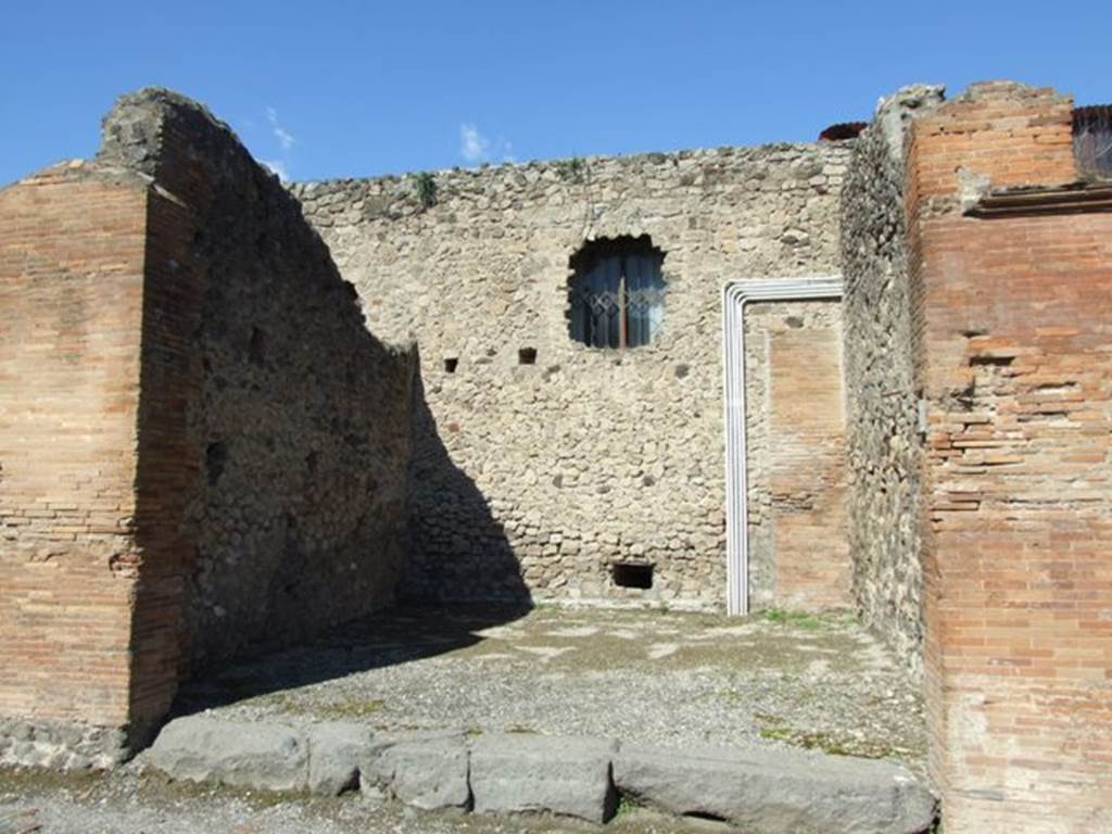 VII.4.20 Pompeii. March 2009.  West and North wall of shop room.