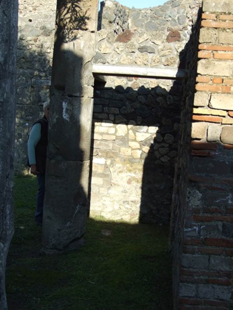 VII.4.31 Pompeii.  March 2009. North Peristyle. Looking east at area on south side of column, leading to Room 35.