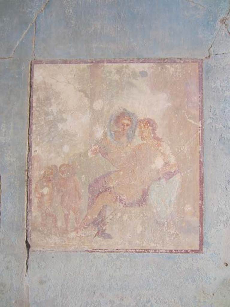 VII.4.31/51 Pompeii. May 2012. Room 18, north wall of exedra. Wall painting of Adonis reclining in Aphrodite’s lap, on the left two cupids can be seen. Photo courtesy of Marina Fuxa.
