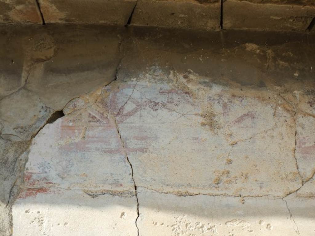 VII.4.31 Pompeii. March 2009. Room 21, remains of painted wall decoration on north wall of triclinium.