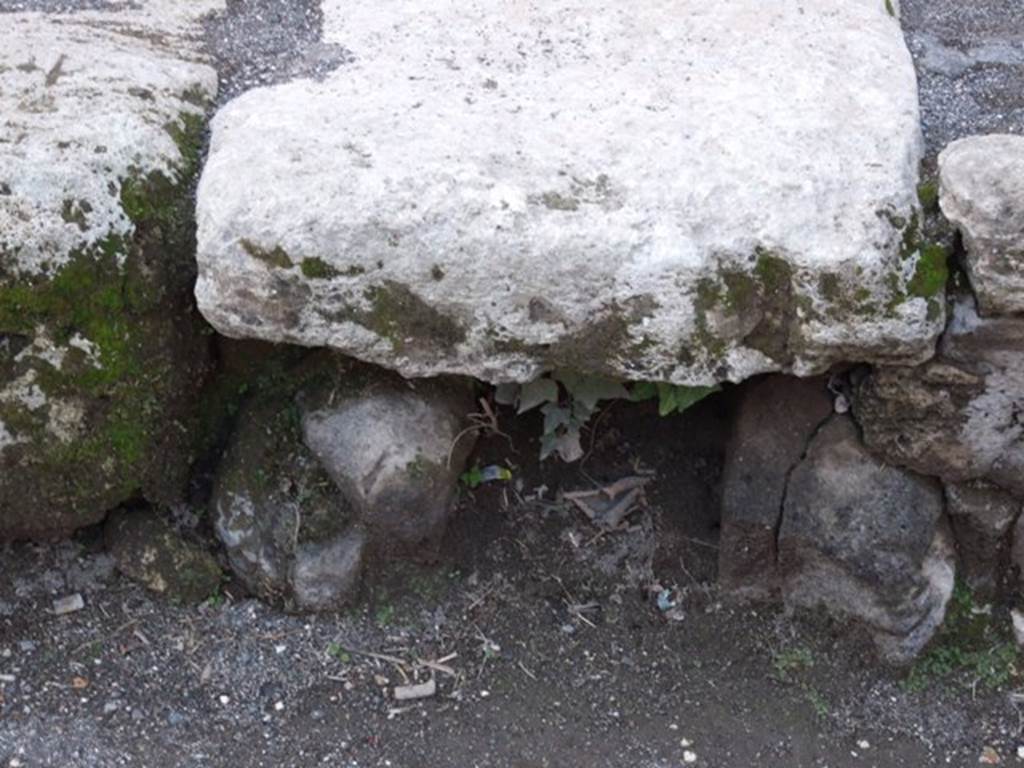 Drainage hole in kerb outside south west corner of room 21 of VII.4.48 near entrance VII.4.43. March 2009.