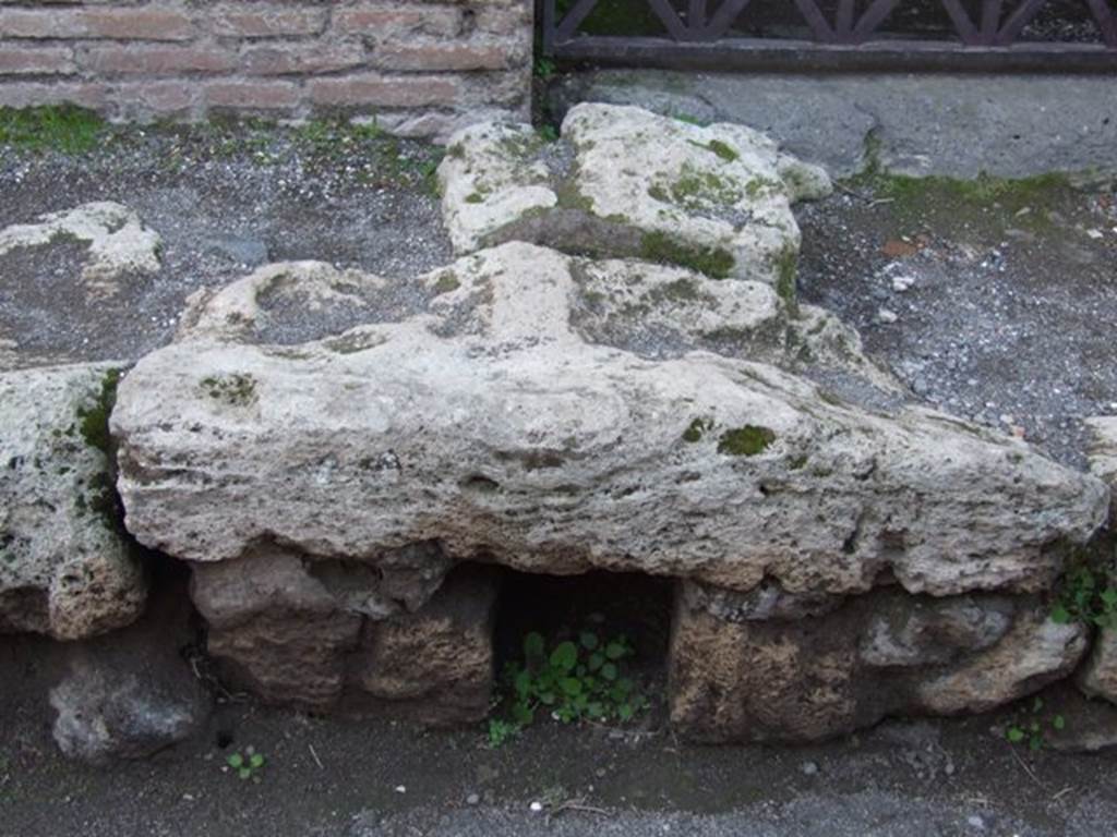 Drainage hole in kerb outside entrance VII.4.43. March 2009.