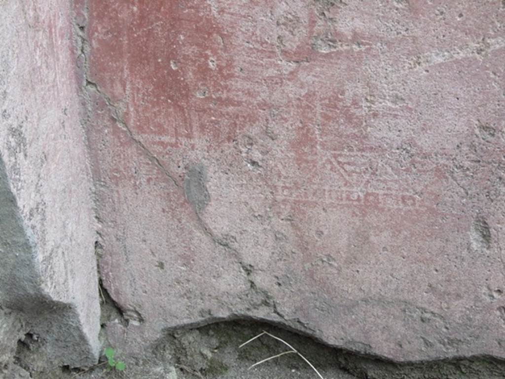 VII.4.48 Pompeii.  March 2009. Room 2.  Atrium. North wall. Painted plaster with faded decoration.