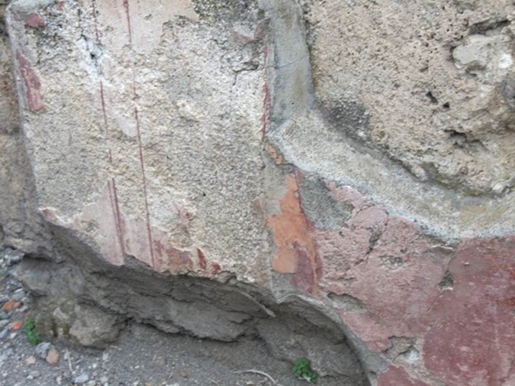 VII.4.48 Pompeii.  March 2009. Room 2.  Atrium. North wall. Painted plaster with faded decoration.
