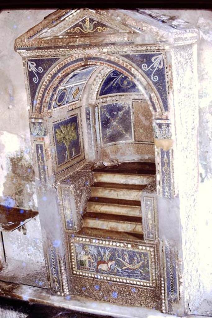 VII.4.56 Pompeii, 1978. Mosaic fountain and table against south wall. Photo by Stanley A. Jashemski.   
Source: The Wilhelmina and Stanley A. Jashemski archive in the University of Maryland Library, Special Collections (See collection page) and made available under the Creative Commons Attribution-Non Commercial License v.4. See Licence and use details. J78f0018
