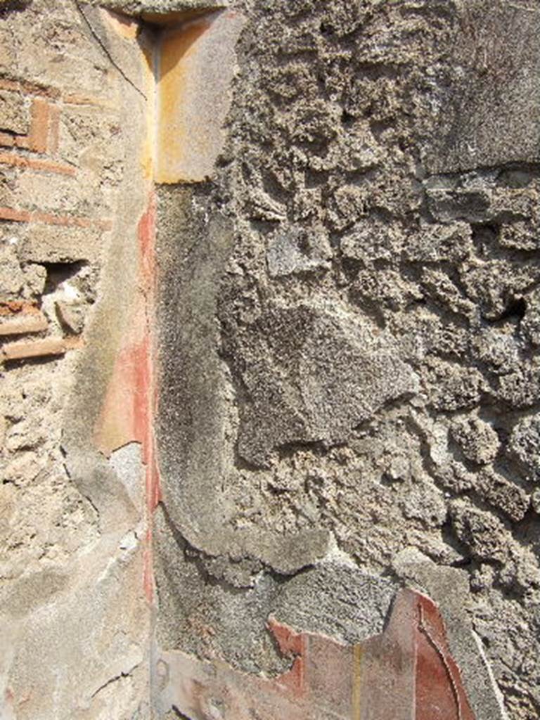 VII.6.30 Pompeii. September 2005. Remains of painted decoration in room on south side of garden area, numbered “143”.
