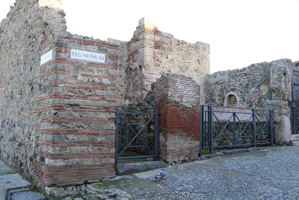 VII.7.11 Pompeii on right with VII.7.12 on left. December 2018.
Looking north-east towards entrance doorways from Via Marina. Photo courtesy of Aude Durand.