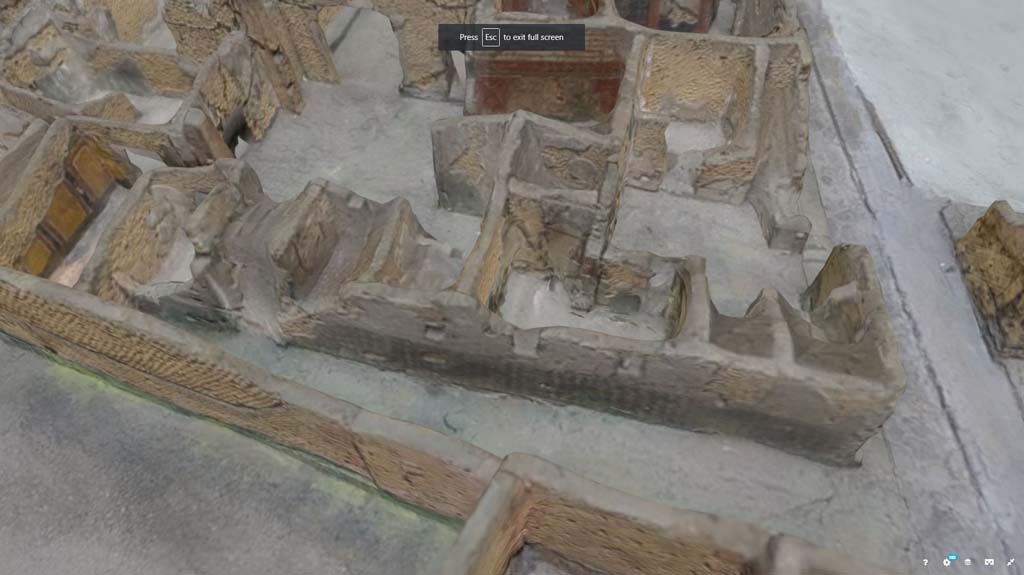 VII.7.21, Pompeii. October 2017. Detail from model in Naples Archaeological Museum.
Looking west in small alley/vicolo towards side wall of VII.7.21, leading to doorway of VII.7.23, centre left. 
The Zebra Stripe decoration can be seen along the wall. 
Information and Foto from Taylor Lauritsen, ERC Grant 681269 DCOR.
