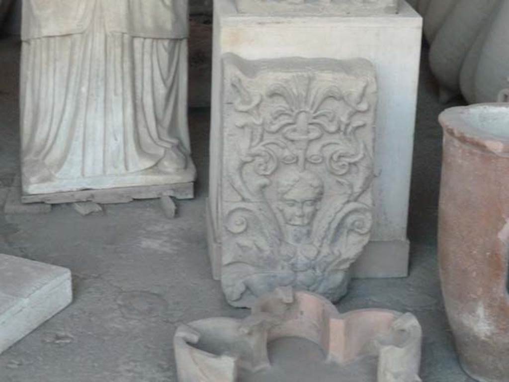 VII.7.29 Pompeii. September 2015. Sculpted plaque with head amongst foliage. Item in storage.