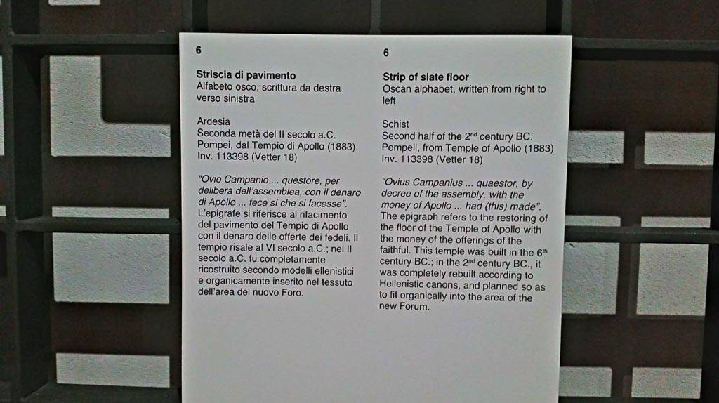 VII.7.32 Pompeii. Information card from Naples Archaeological Museum, photo courtesy of Giuseppe Ciaramella, June 2017.
Ovius Campanius … quaestor, by decree of the assembly, with the money of Apollo… had (this) made.
The inscription refers to the restoring of the floor of the Temple of Apollo with the money of the offerings of the faithful.
