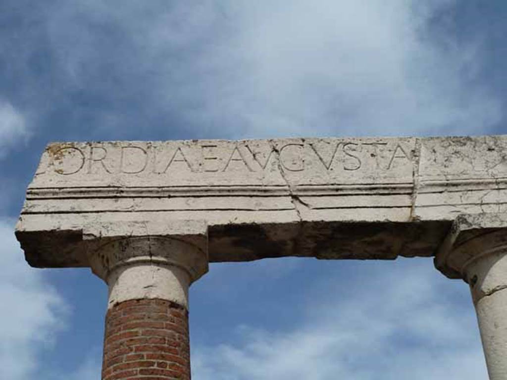 VII.8 Pompeii Forum. May 2010. Part of the inscription in large letters on the entablature of the portico, reading -
CORDIAE AVGVSTA