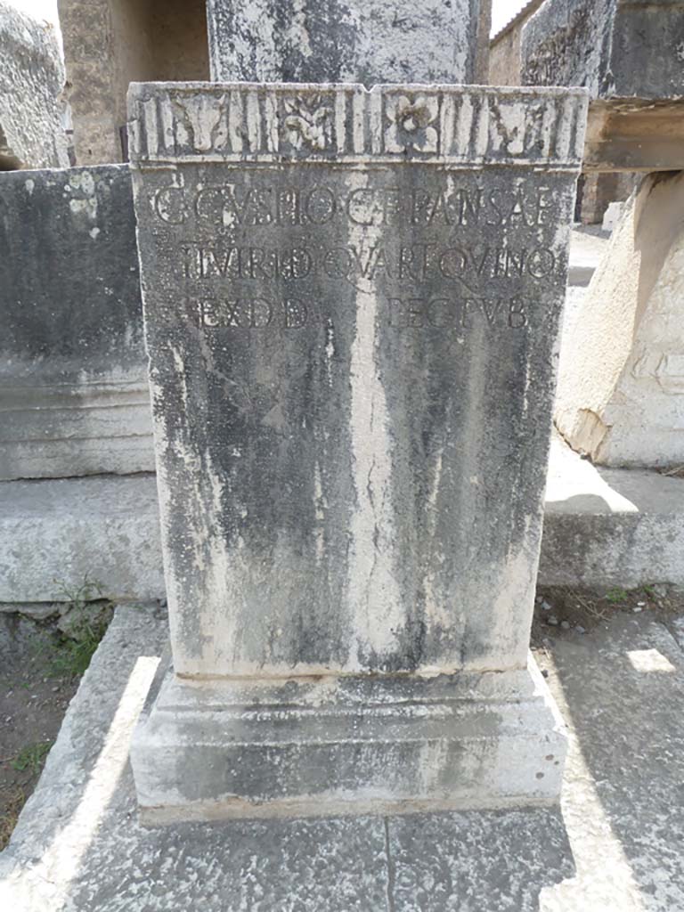 VII.8 Pompeii Forum. May 2010. Another pedestal base for statue. This has the Latin inscription –

C . CVSPIO . C. F. F . PANSAE
II . VIR . I . D. QVART . QVINQ
EX . D . D . PEC . PVB 

See Pappalardo, U., 2001. La Descrizione di Pompei per Giuseppe Fiorelli (1875). Napoli: Massa Editore. (p.102)

According to Pagano and Prisciandaro, this was found in May 1816, it was a brick pedestal clad in marble, near to a travertine column.
It read –
C(aio) Cuspio C(ai) f(ilio) Pansae
Iivir(o) i(ure) d(icundo) quart(um) quinq(uennial)
ex d(ecreto) d(ecurionum) pec(unia) pub(lica)      [CIL X 790]
See Pagano, M. and Prisciandaro, R., 2006. Studio sulle provenienze degli oggetti rinvenuti negli scavi borbonici del regno di Napoli. Naples: Nicola Longobardi. 
 (p.114)   PAH III, 7.

According to Cooley this translates as
To Gaius Cuspius Pansa, son of Gaius, duumvir with judicial power four times, quinquennial. 
By decree of the town councillors, at public expense.
See Cooley, A. and M.G.L., 2004. Pompeii: A Sourcebook. London: Routledge. F94, p. 131.
