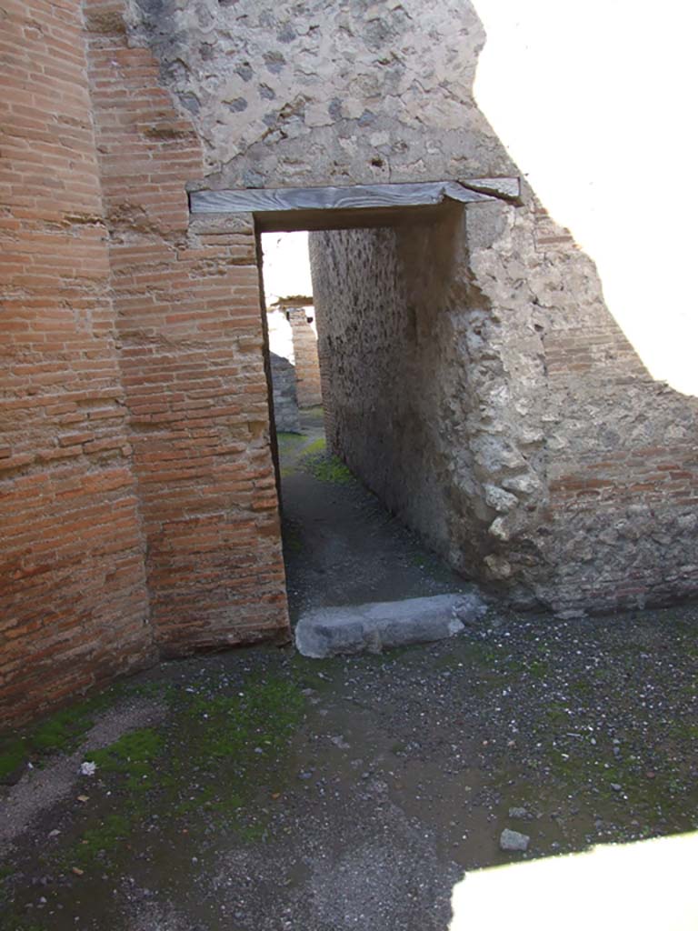 VII.9.1 Pompeii. 2017/2018/2019. 
Looking east through portico towards north side of entrance doorway. 
Photo courtesy of Giuseppe Ciaramella.
