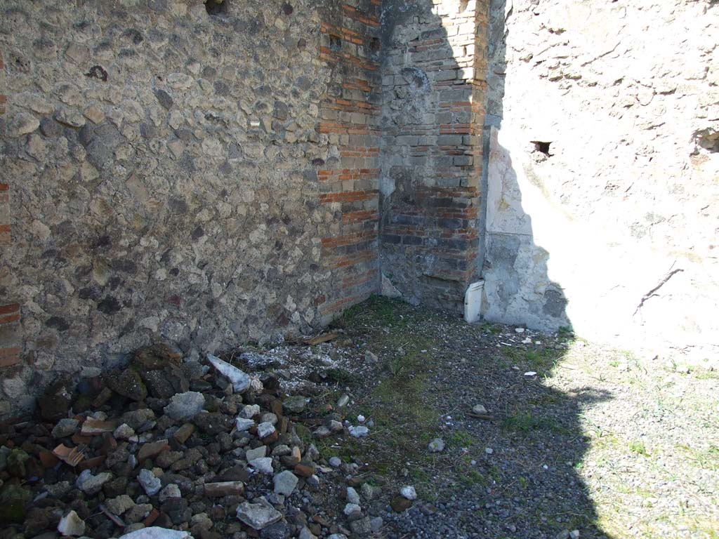 VII.9.1 Pompeii. March 2009.  West wall, north of entrance 6. Looking towards small niche 3 in north west corner of courtyard.